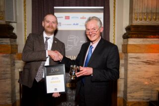 John Hatch of Ram Brewery (right) receives the Brewer of the Year 2021 trophy from then SIBA chief executive James Calder